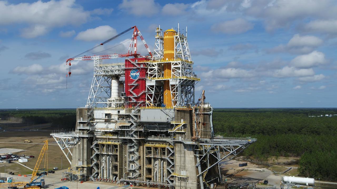 A NASA drone photo offers a bird’s-eye view of the B-2 Test Stand at NASA’s Stennis Space Center with the first flight core stage for NASA’s new Space Launch System (SLS) installed for Green Run testing. The SLS core stage is undergoing a series of tests on its integrated systems prior to its use on the Artemis I mission. NASA is building SLS to return humans, including the first woman, to the Moon as part of the Artemis program and to prepare for eventual missions to Mars. The Green Run series at Stennis culminates with a hot fire of the core stage’s four RS-25 engines, just as during an actual launch.